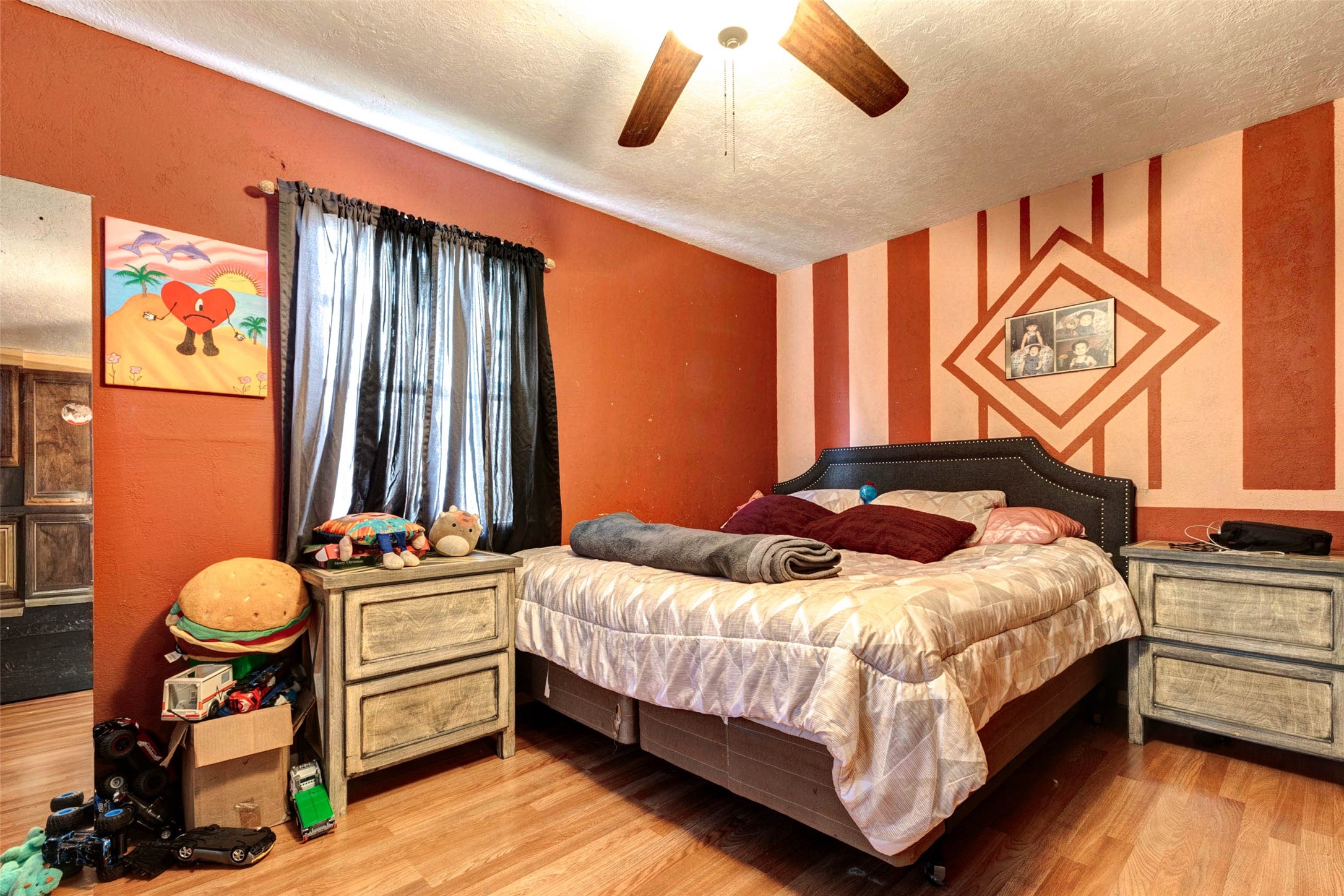 4008 Colvin Street Houston, TX 77013 - Photo 9 of 28 a bedroom with a bed and wooden floor