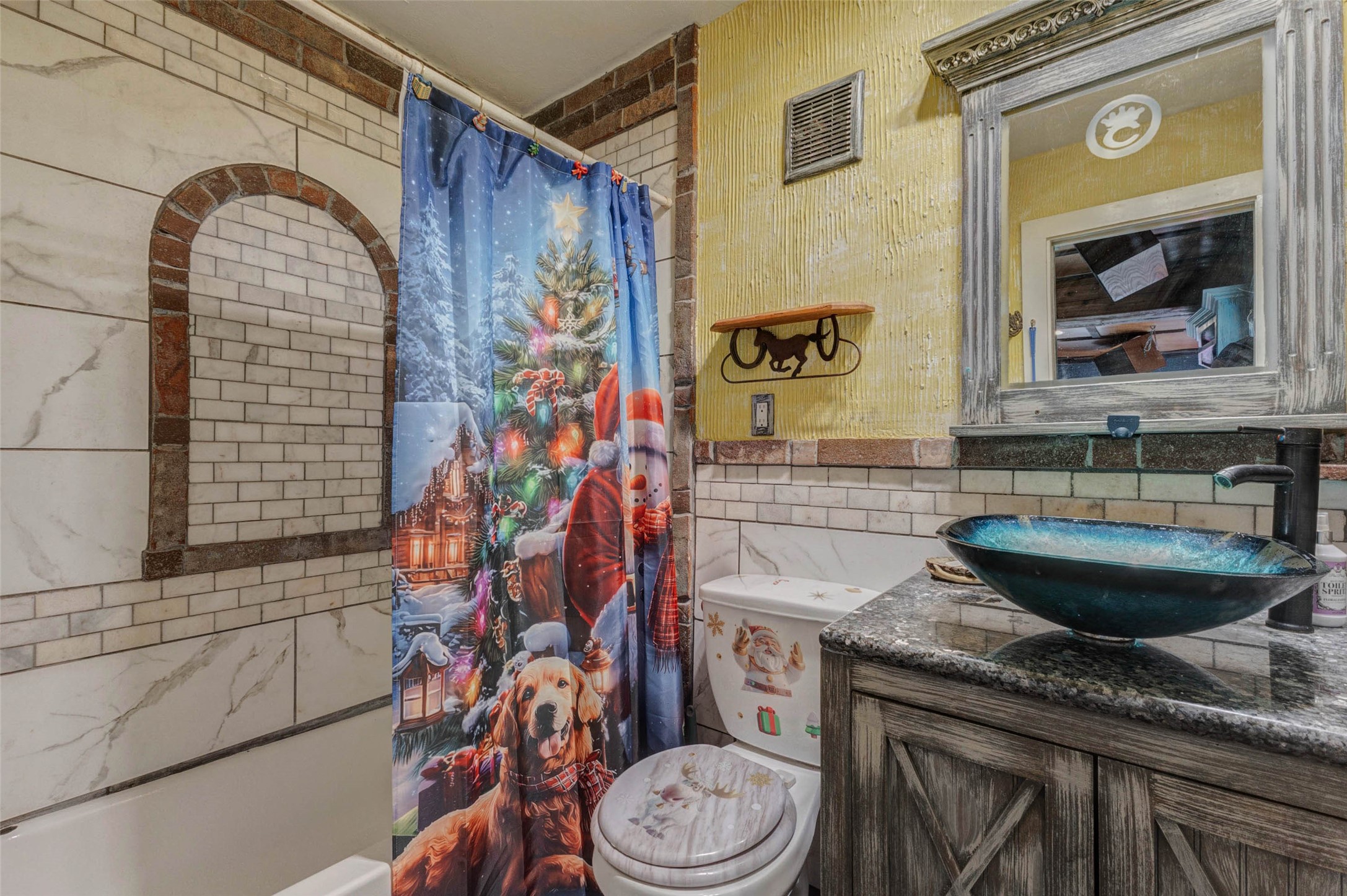4008 Colvin Street Houston, TX 77013 - Photo 10 of 28 a bathroom with a granite countertop toilet sink and mirror