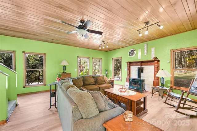 a spacious bedroom with a bed a couch and dresser