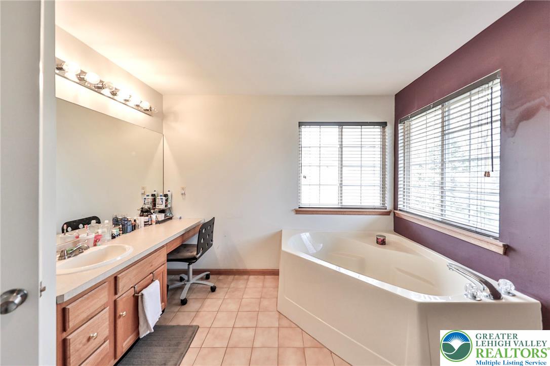 2260 Reo Drive Effort, PA 18330 - Photo 32 of 40 a bathroom with a tub sink and mirror