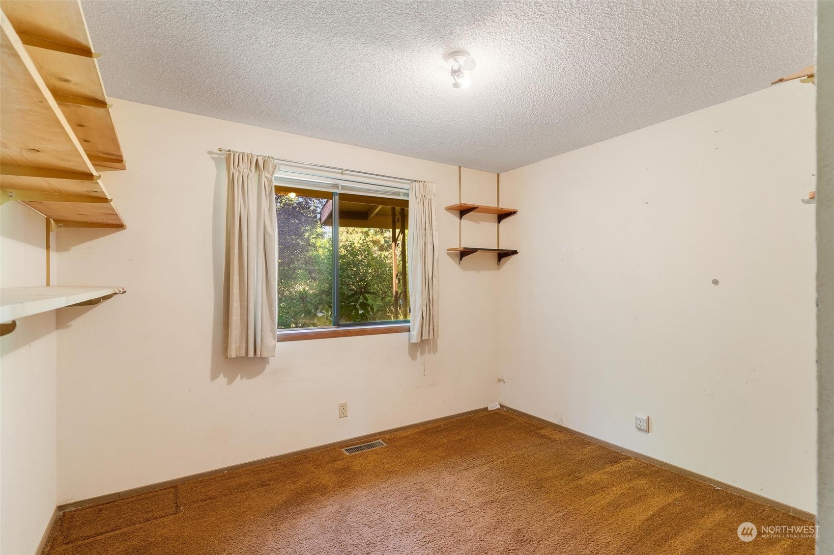 13223 Vail Cut Off Road Southeast Rainier, WA 98576 - Photo 15 of 32 an empty room with a window