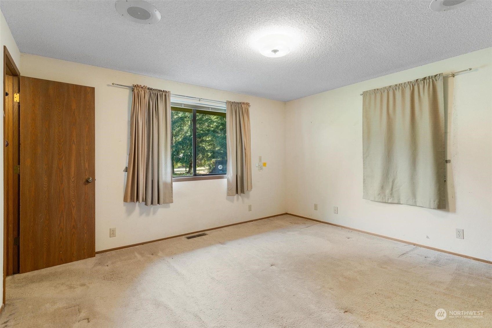 13223 Vail Cut Off Road Southeast Rainier, WA 98576 - Photo 16 of 32 an empty room with windows