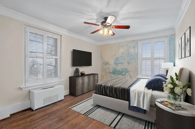 a bedroom with furniture and a window