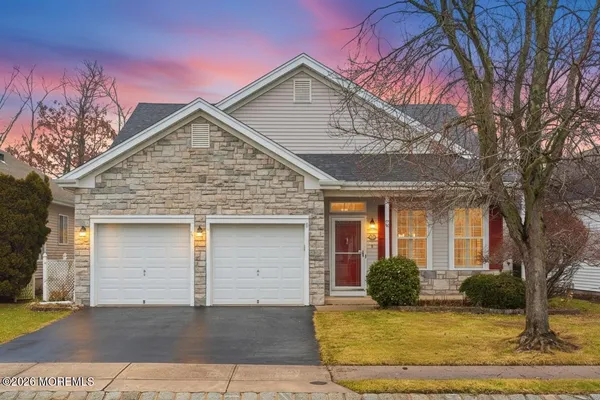 a front view of a house with garden