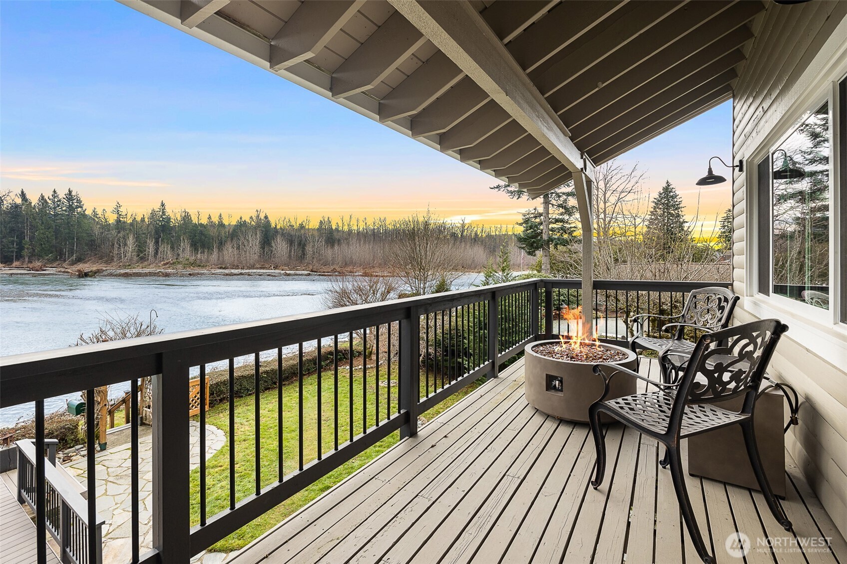 1122 Dyer Road Sultan, WA 98294 - Photo 29 of 40 a view of a balcony with wooden floor and outdoor seating