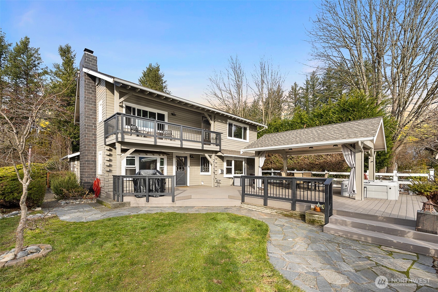 1122 Dyer Road Sultan, WA 98294 - Photo 32 of 40 a front view of a house with swimming pool and sitting area