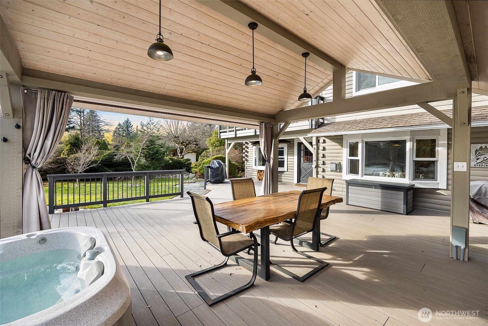 1122 Dyer Road Sultan, WA 98294 - Photo 33 of 40 a view of a patio with a table chairs and backyard