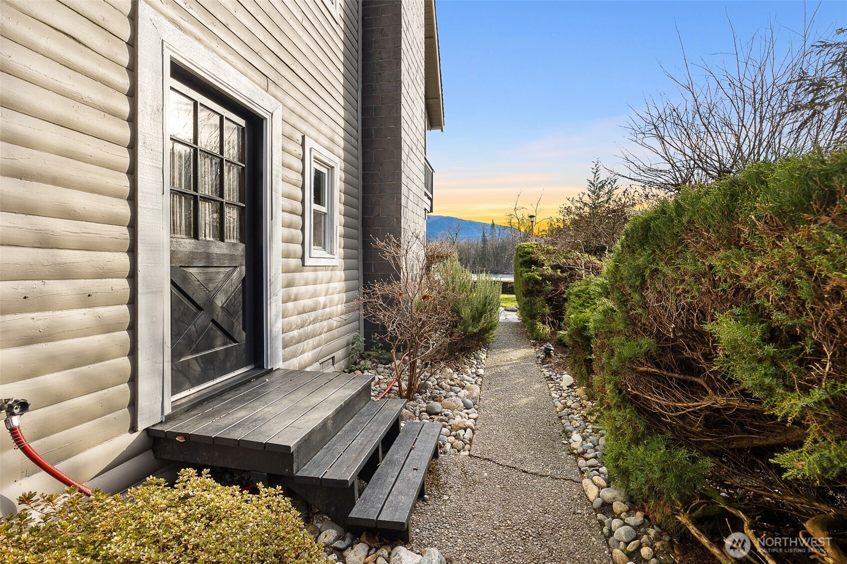 1122 Dyer Road Sultan, WA 98294 - Photo 36 of 40 a wooden bench sitting in front of a building