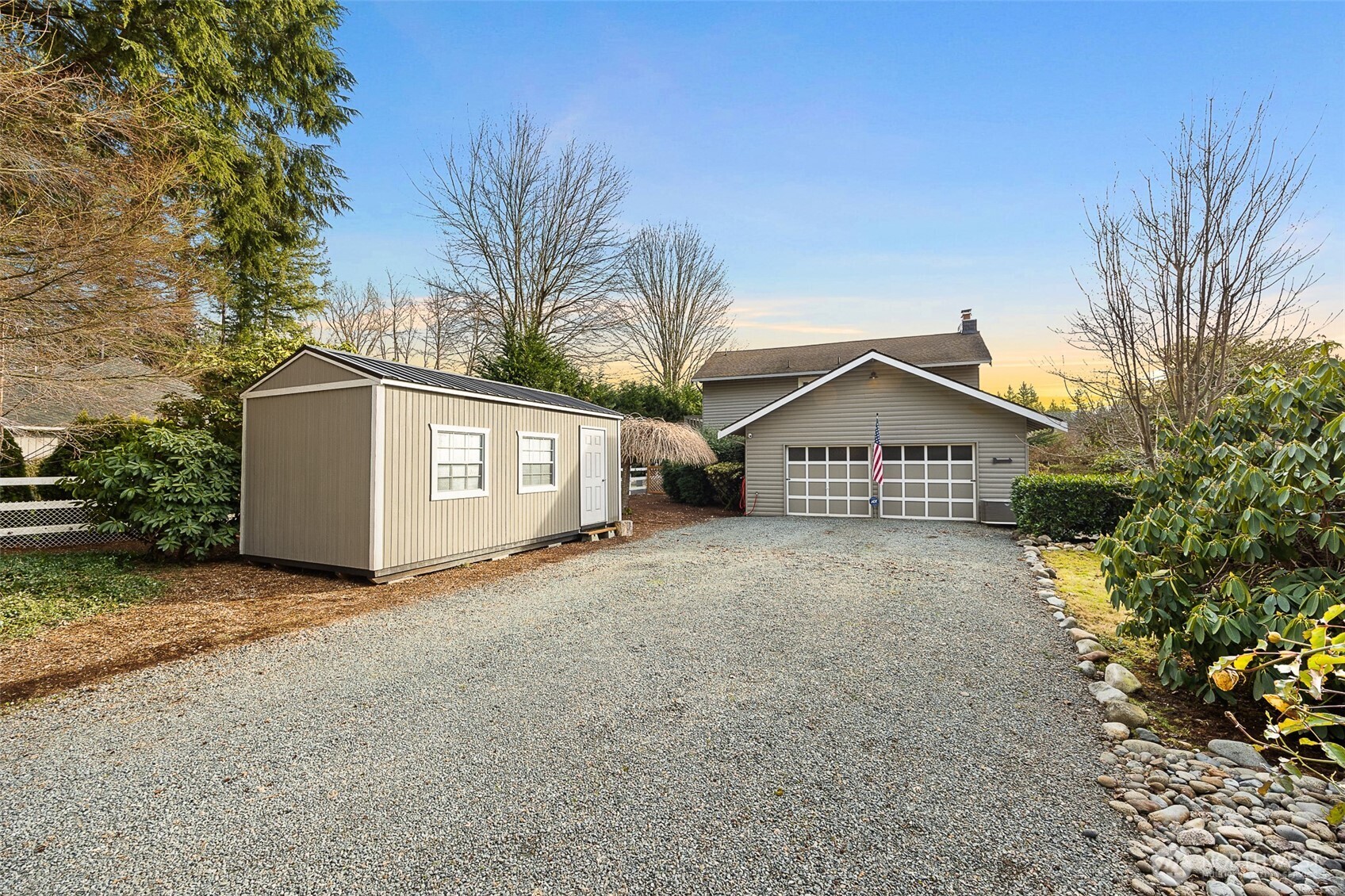 1122 Dyer Road Sultan, WA 98294 - Photo 5 of 40 a view of a house with a yard and garage
