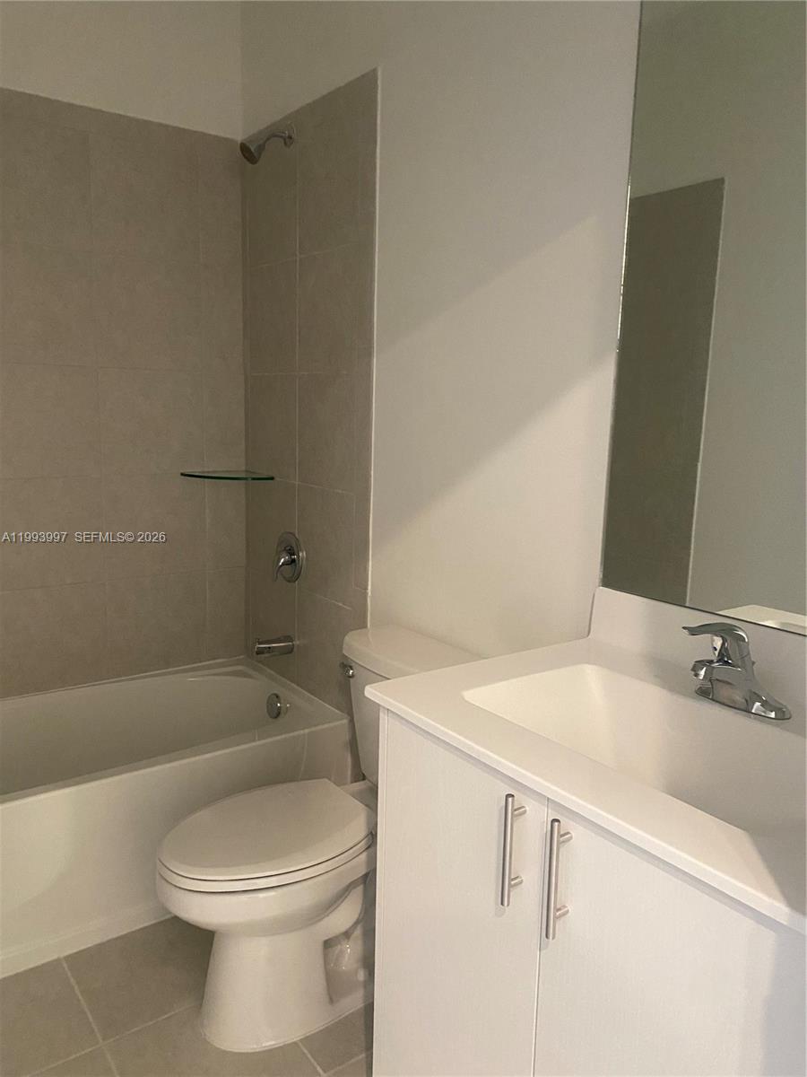 12773 Southwest 234th Terrace Homestead, FL 33032 - Photo 10 of 11 a bathroom with a sink a toilet and shower