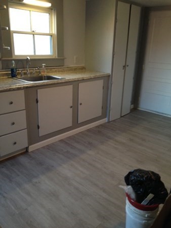 30 3rd Street Montague, MA 01376 - Photo 13 of 15 a kitchen with granite countertop white cabinets and sink