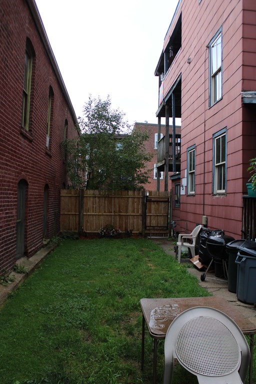 30 3rd Street Montague, MA 01376 - Photo 4 of 15 a patio with table and chairs and potted plants