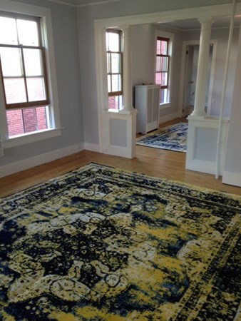 30 3rd Street Montague, MA 01376 - Photo 8 of 15 an empty room with wooden floor and window