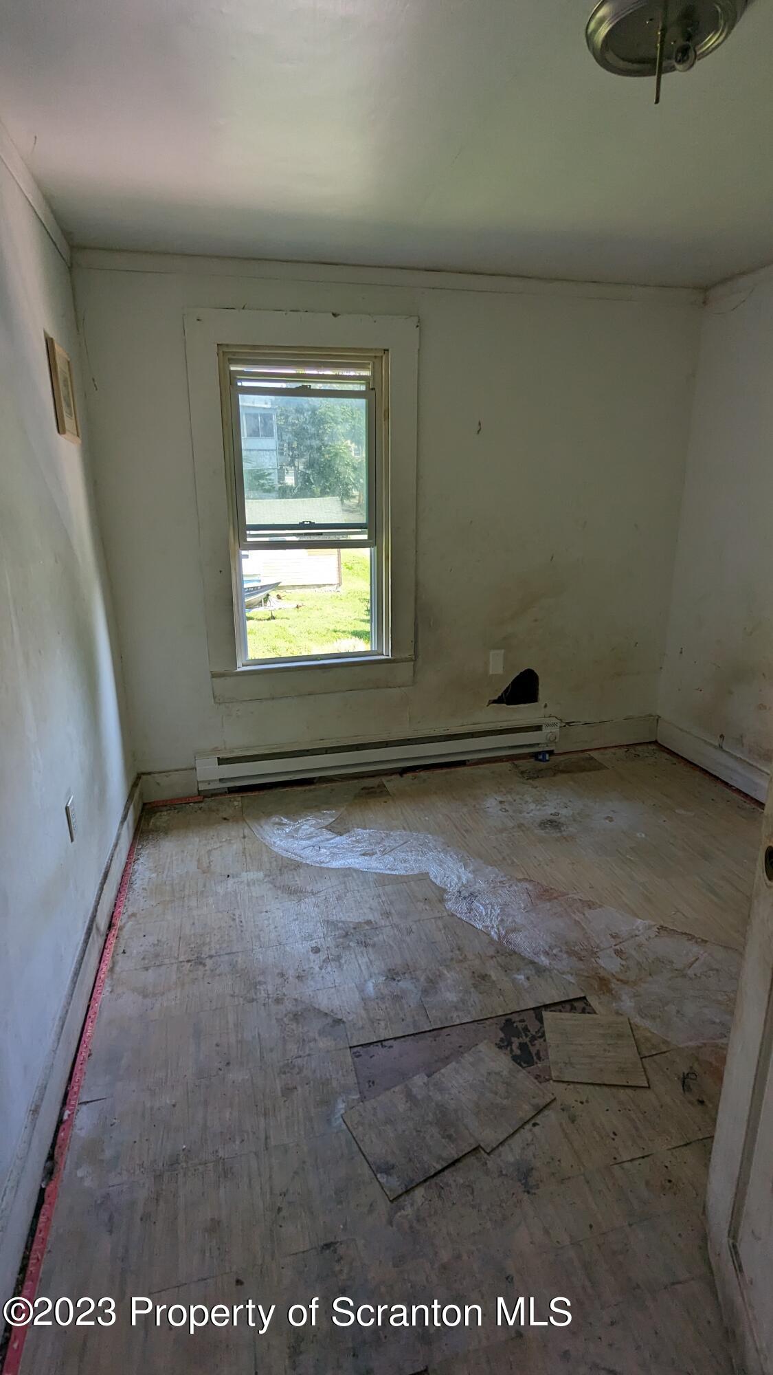 357 Hughes Court Scranton, PA 18504 - Photo 12 of 16 a view of an empty room with a window