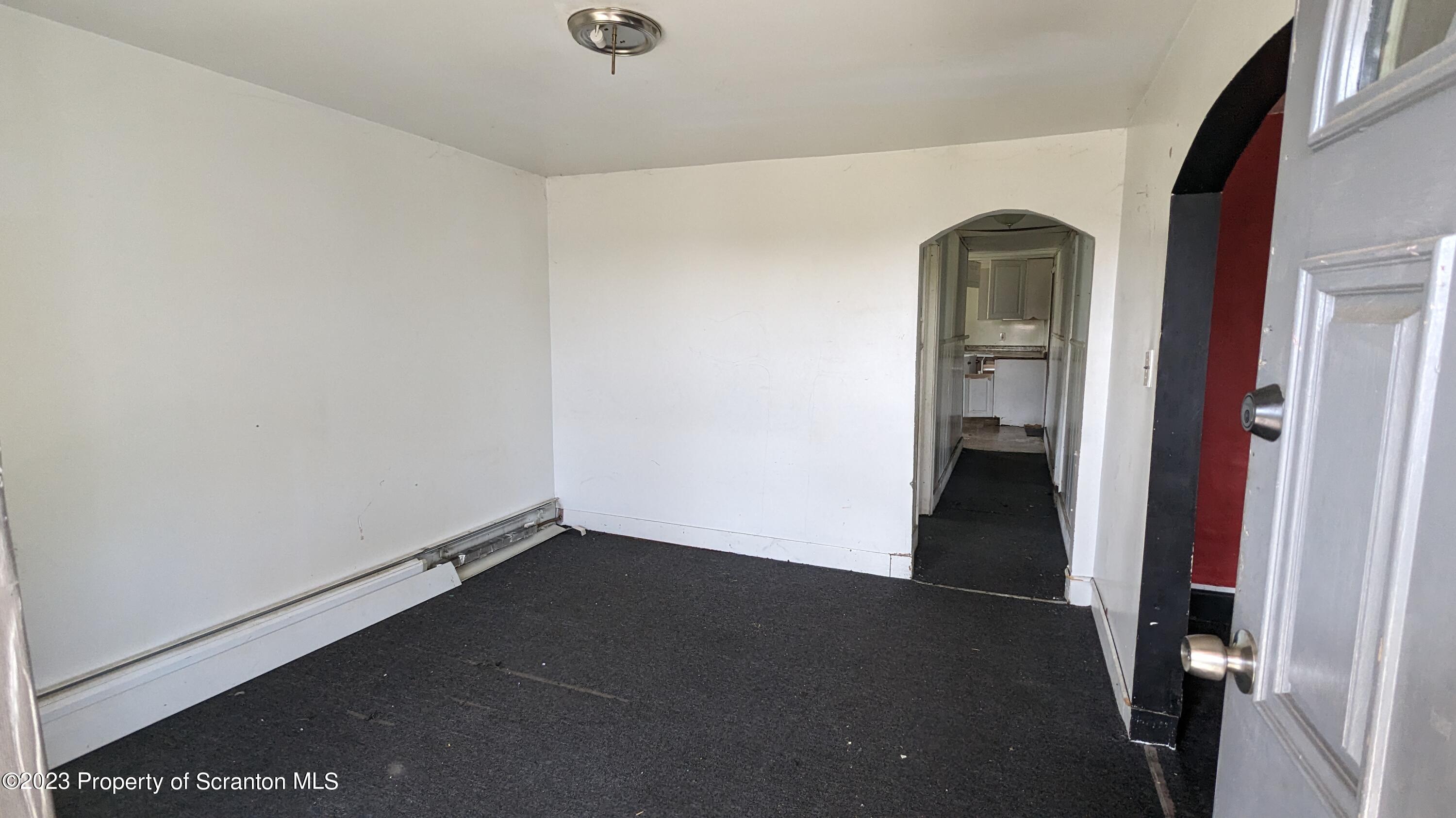 357 Hughes Court Scranton, PA 18504 - Photo 2 of 16 an empty room with a door
