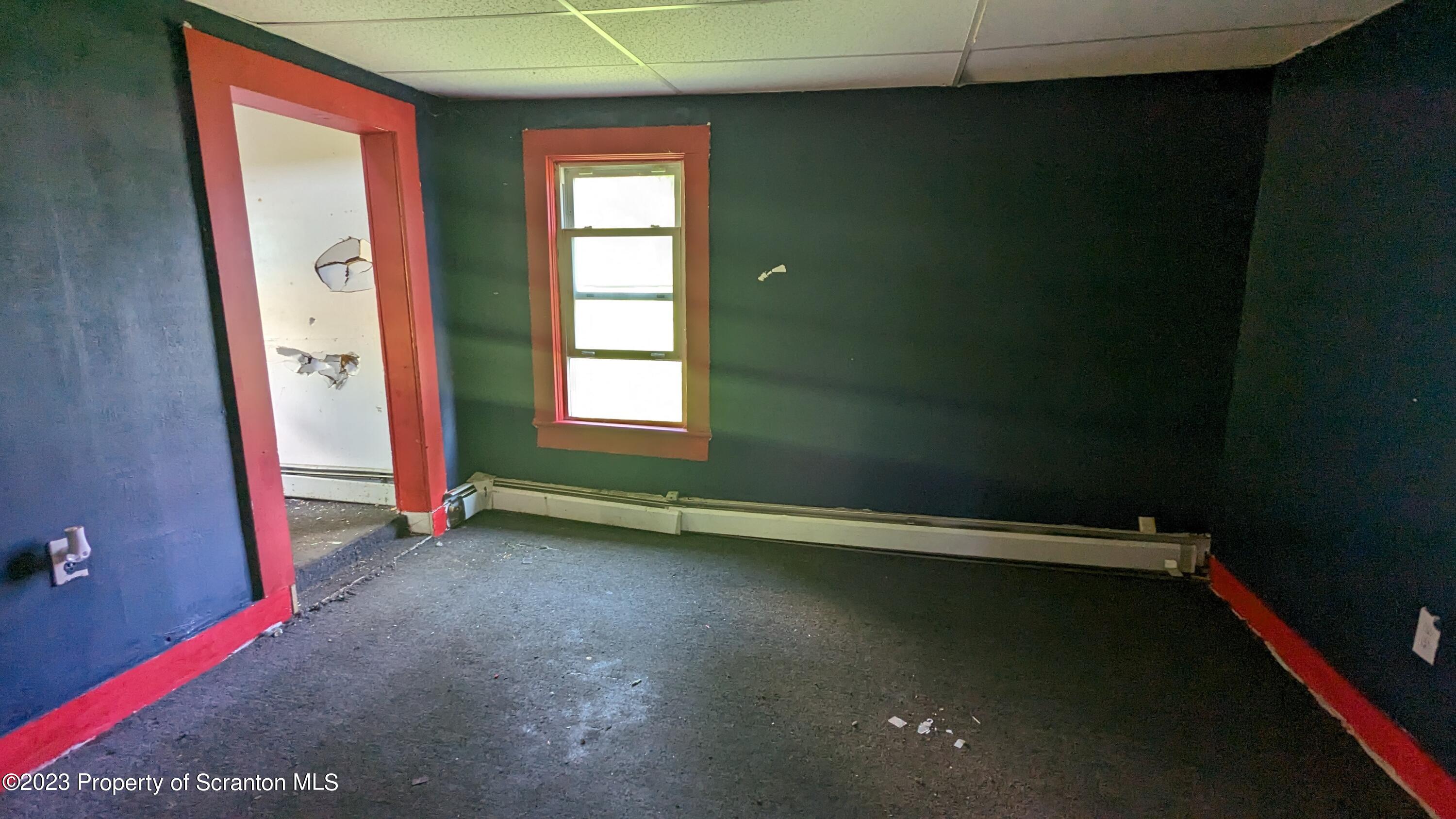 357 Hughes Court Scranton, PA 18504 - Photo 5 of 16 an empty room with a door