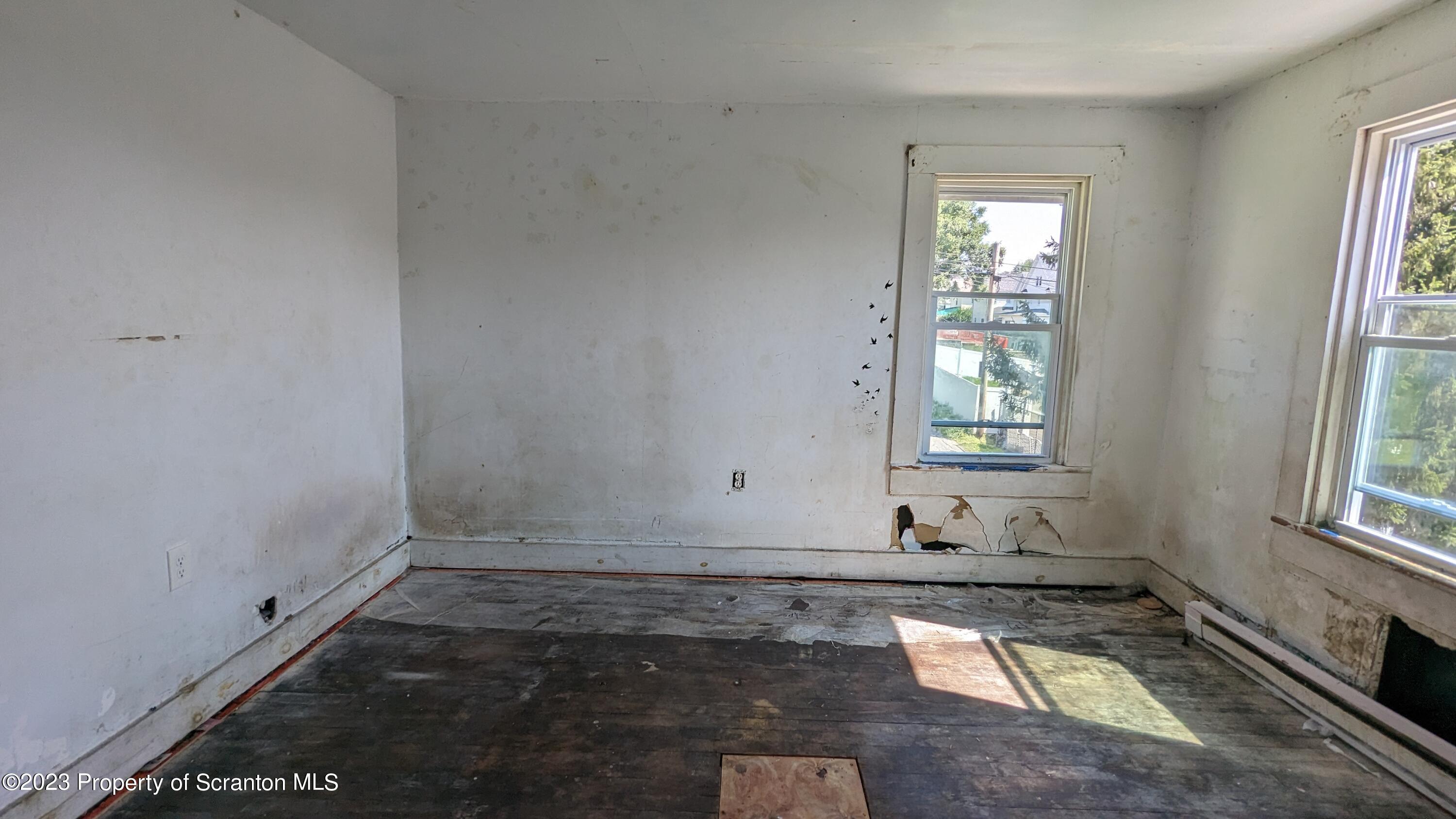 357 Hughes Court Scranton, PA 18504 - Photo 6 of 16 an empty room with windows
