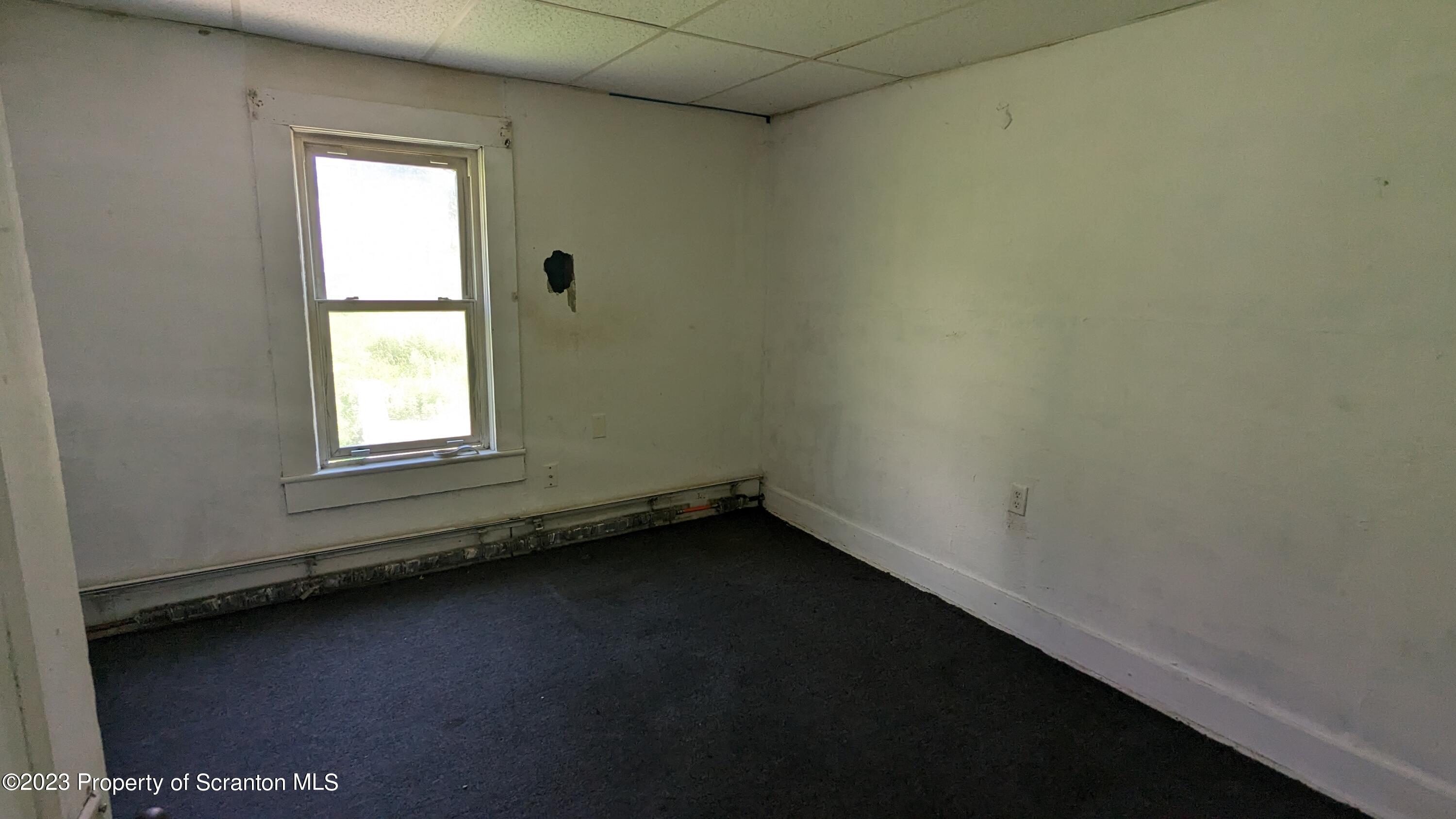 357 Hughes Court Scranton, PA 18504 - Photo 8 of 16 an empty room with a window