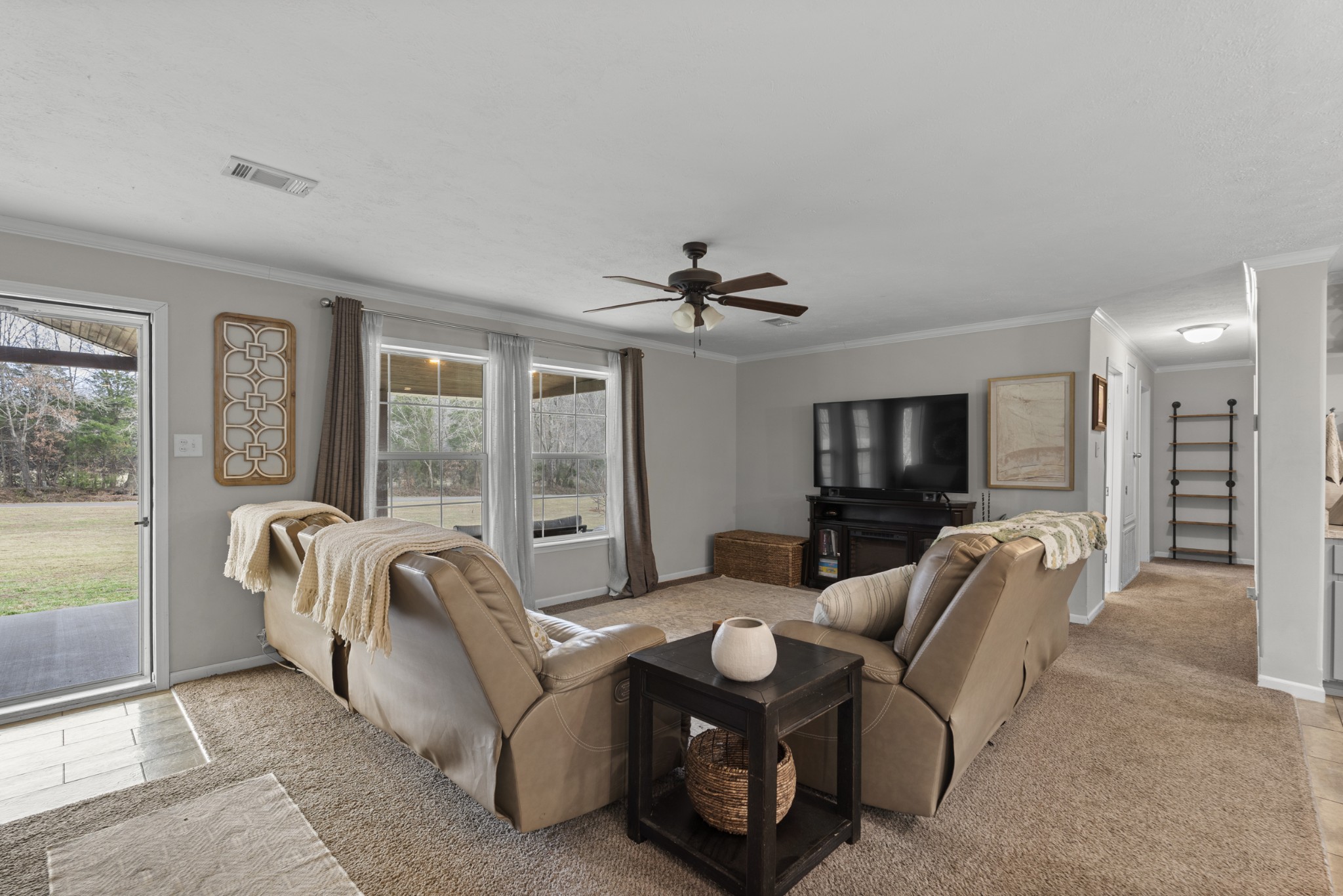60 Edgewood Road McEwen, TN 37101 - Photo 16 of 56 a living room with furniture and a flat screen tv