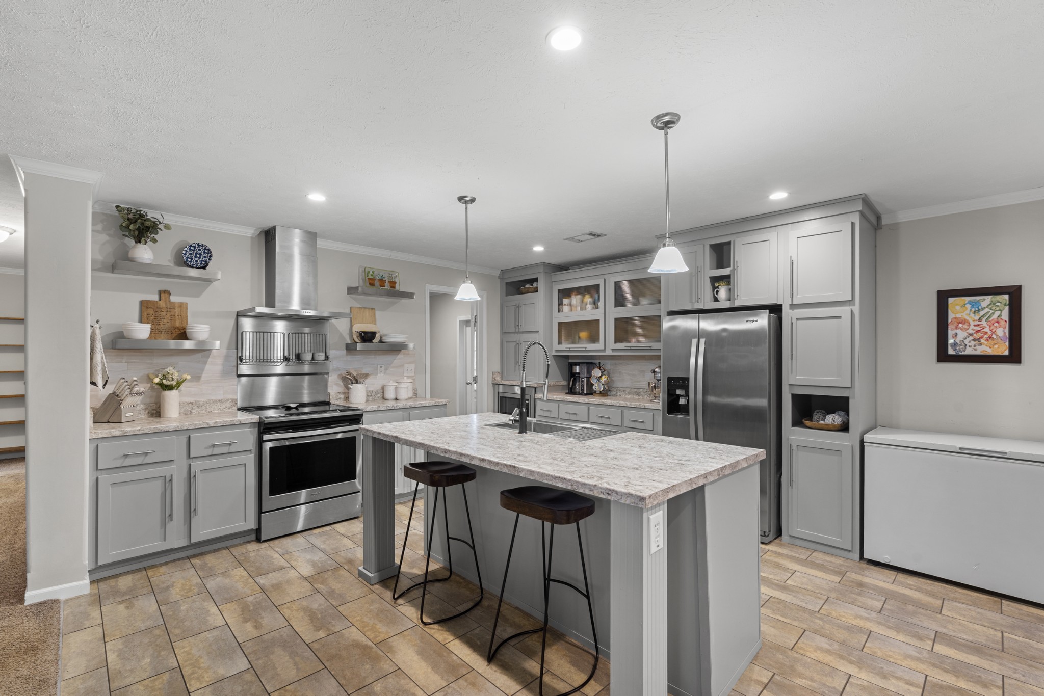 60 Edgewood Road McEwen, TN 37101 - Photo 18 of 56 a kitchen with stainless steel appliances granite countertop a sink stove and refrigerator