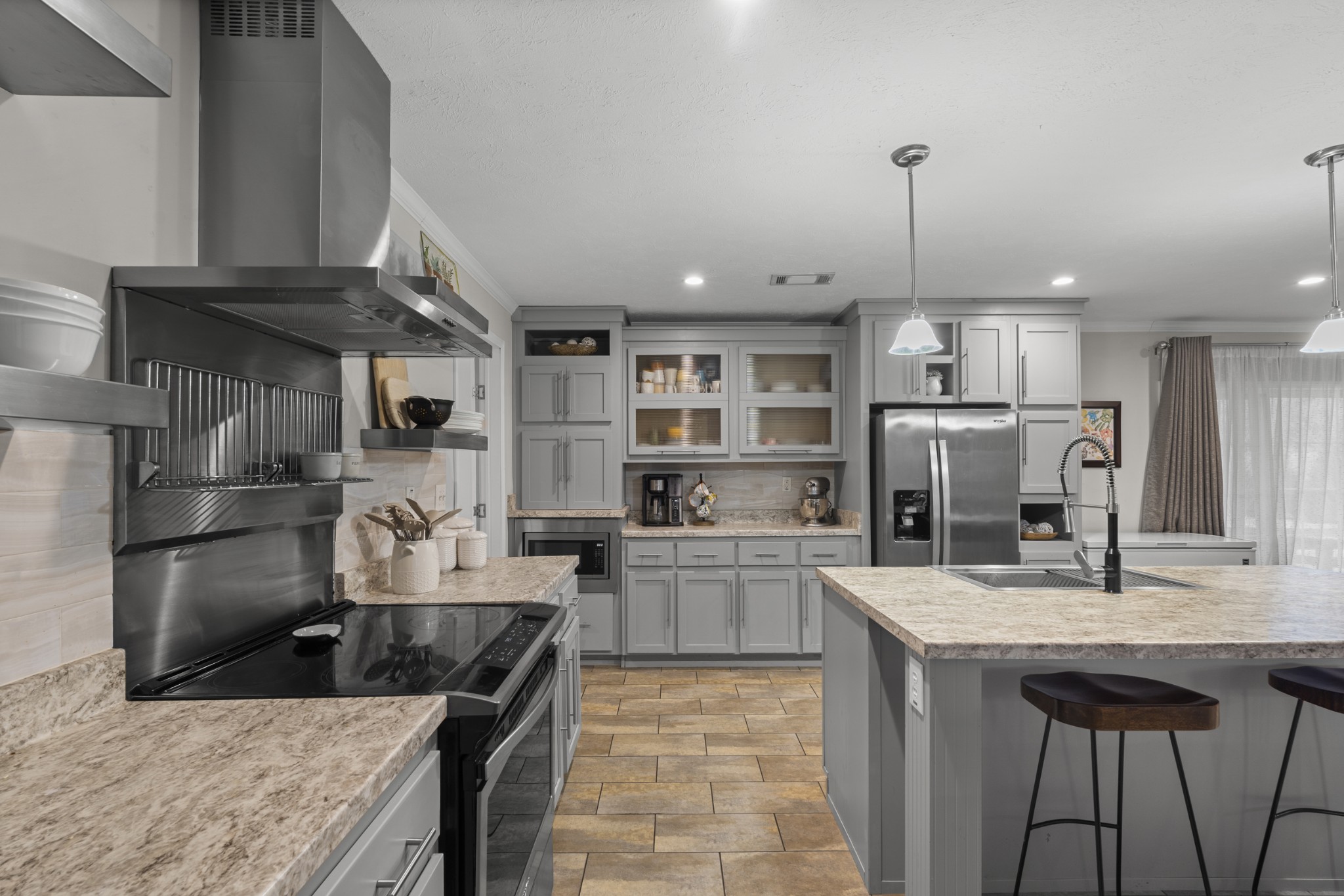 60 Edgewood Road McEwen, TN 37101 - Photo 19 of 56 a kitchen with stainless steel appliances granite countertop a sink a stove and a refrigerator