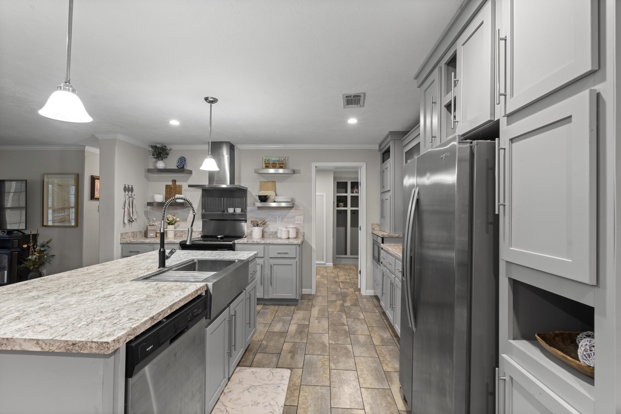 60 Edgewood Road McEwen, TN 37101 - Photo 20 of 56 a kitchen with stainless steel appliances granite countertop a refrigerator a stove a sink and a refrigerator