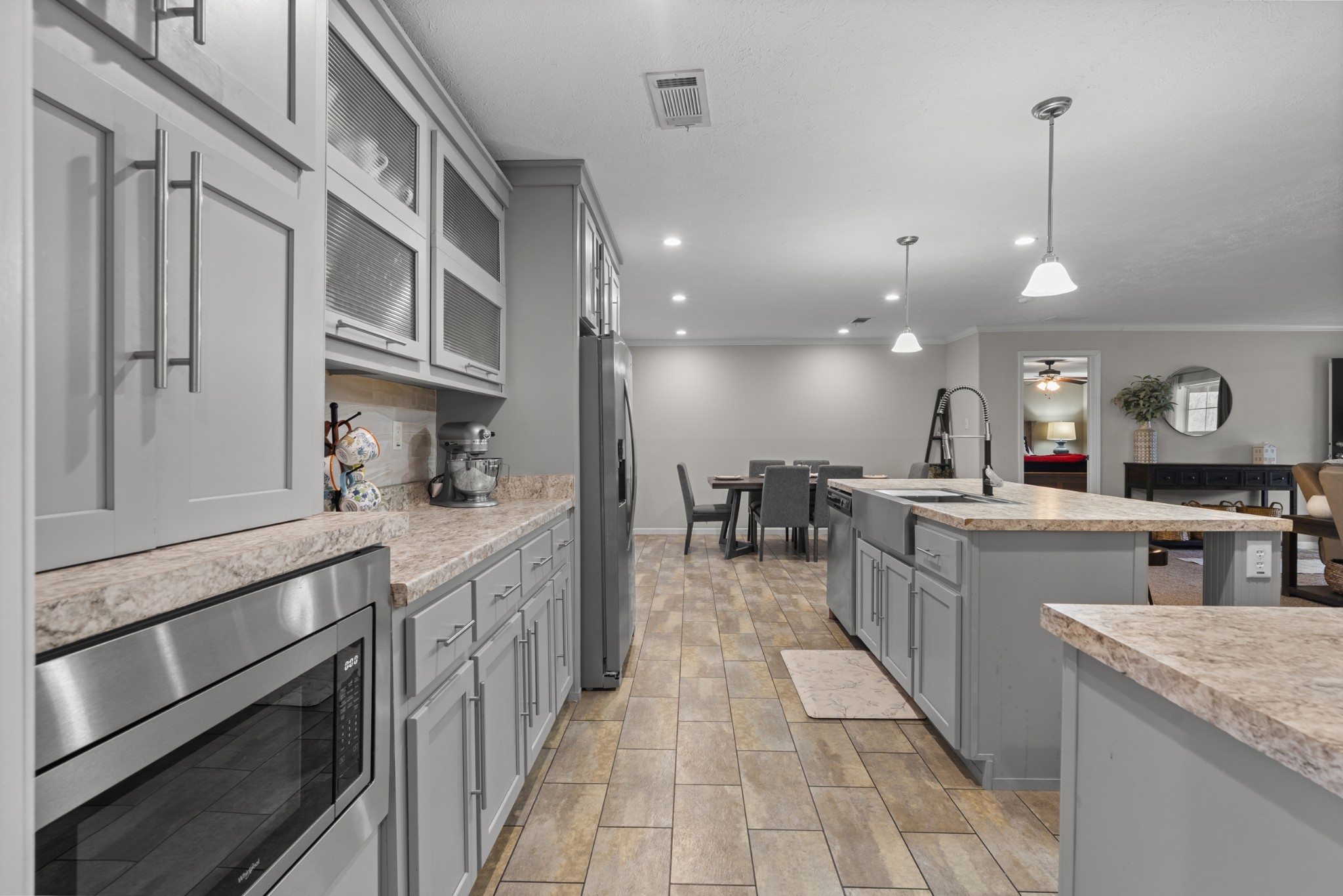 60 Edgewood Road McEwen, TN 37101 - Photo 21 of 56 a large kitchen with stainless steel appliances kitchen island granite countertop a large counter top a stove and a sink