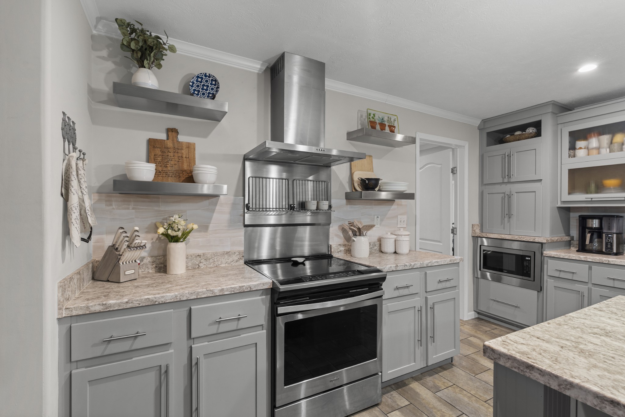60 Edgewood Road McEwen, TN 37101 - Photo 23 of 56 a kitchen with granite countertop a sink stove and refrigerator