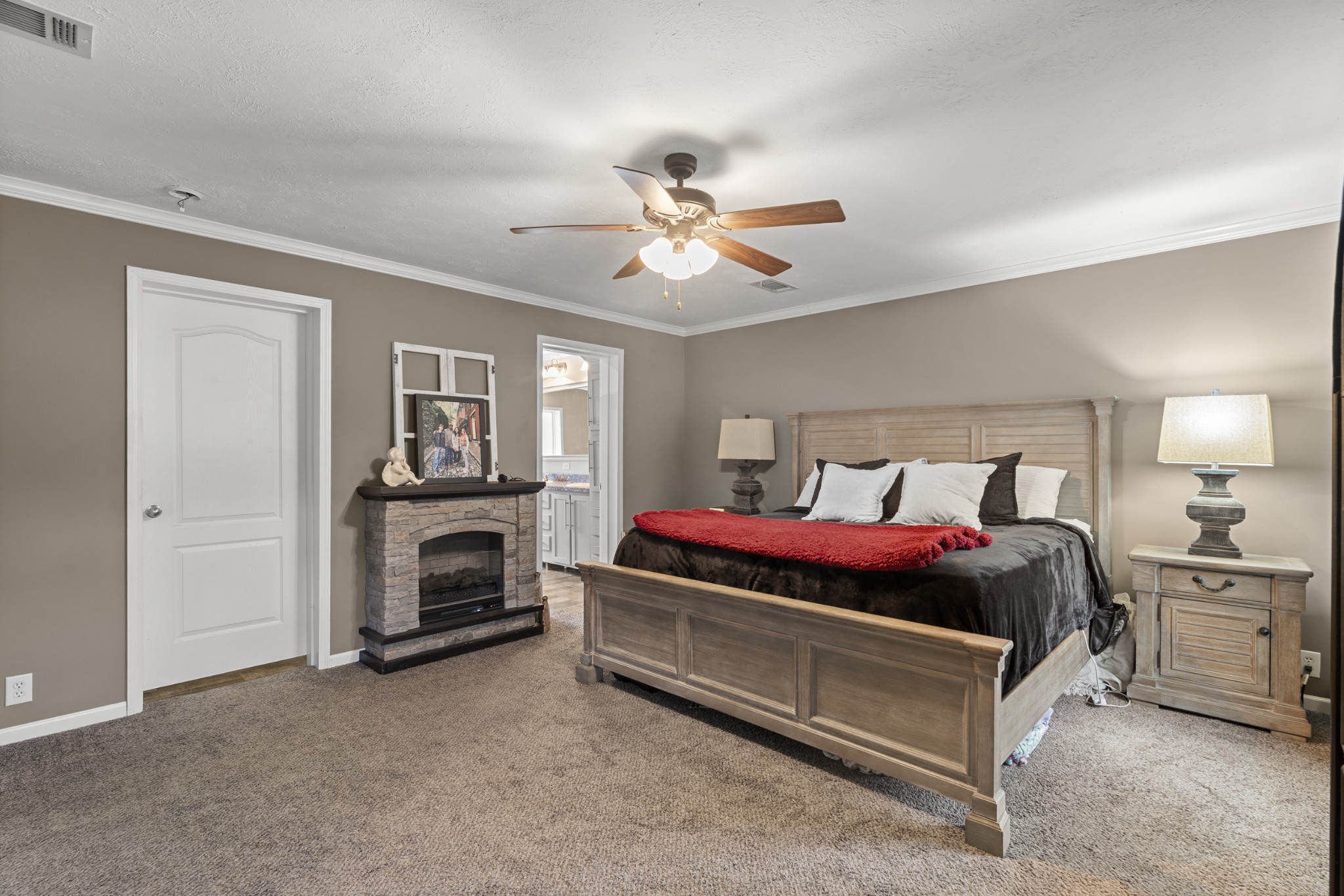 60 Edgewood Road McEwen, TN 37101 - Photo 26 of 56 a bedroom with a bed and a fireplace