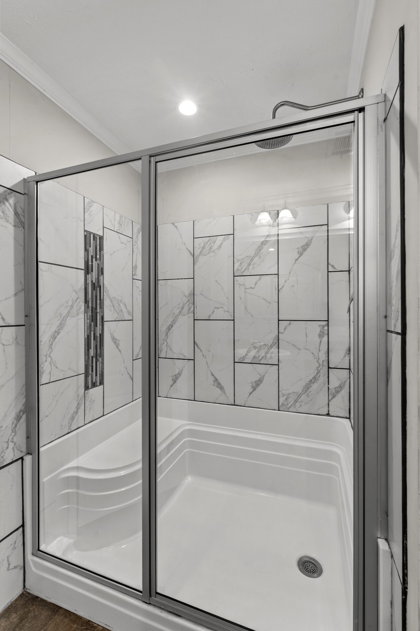 60 Edgewood Road McEwen, TN 37101 - Photo 30 of 56 a bathroom with a glass shower door