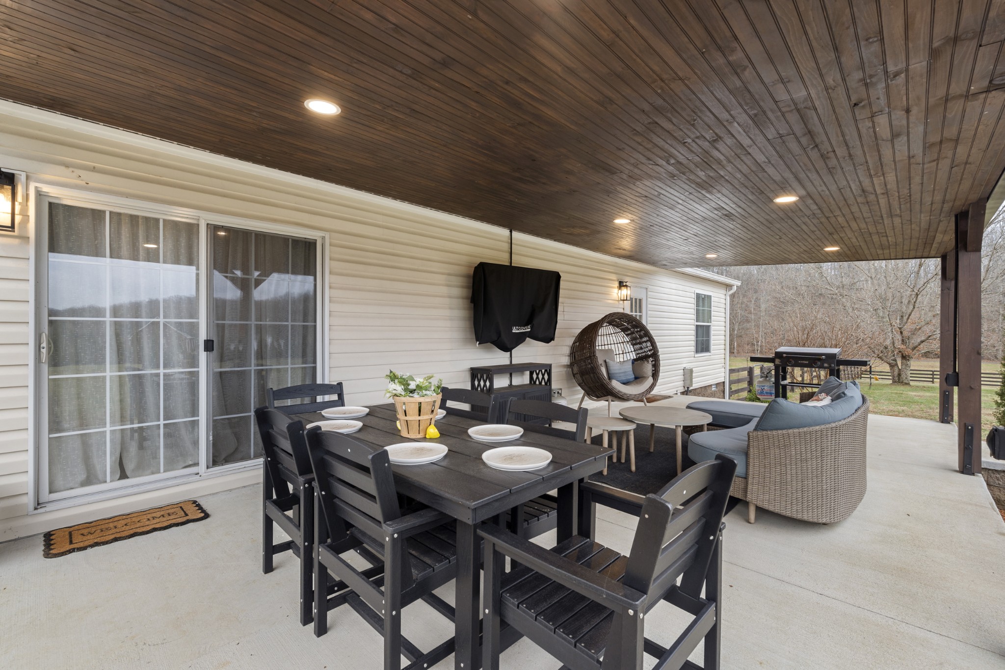 60 Edgewood Road McEwen, TN 37101 - Photo 38 of 56 a dining room with furniture and a flat screen tv