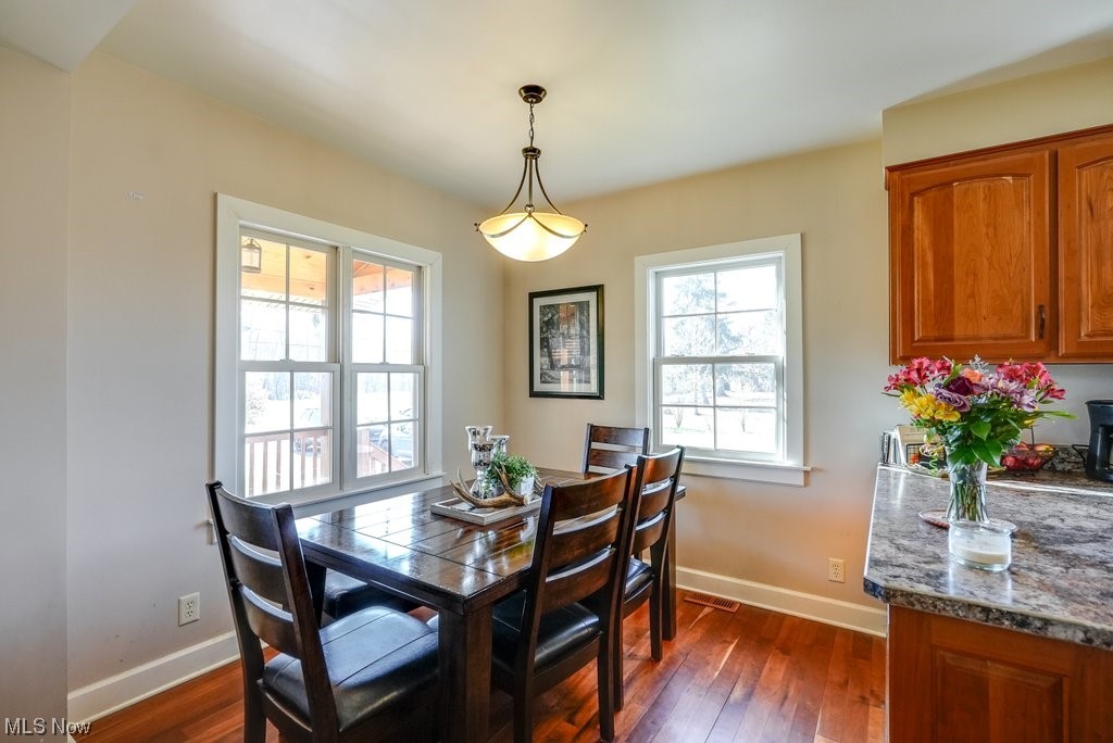 3417 Lake Rockwell Road Ravenna, OH 44266 - Photo 11 of 35 Dining area with dark wood-type flooring