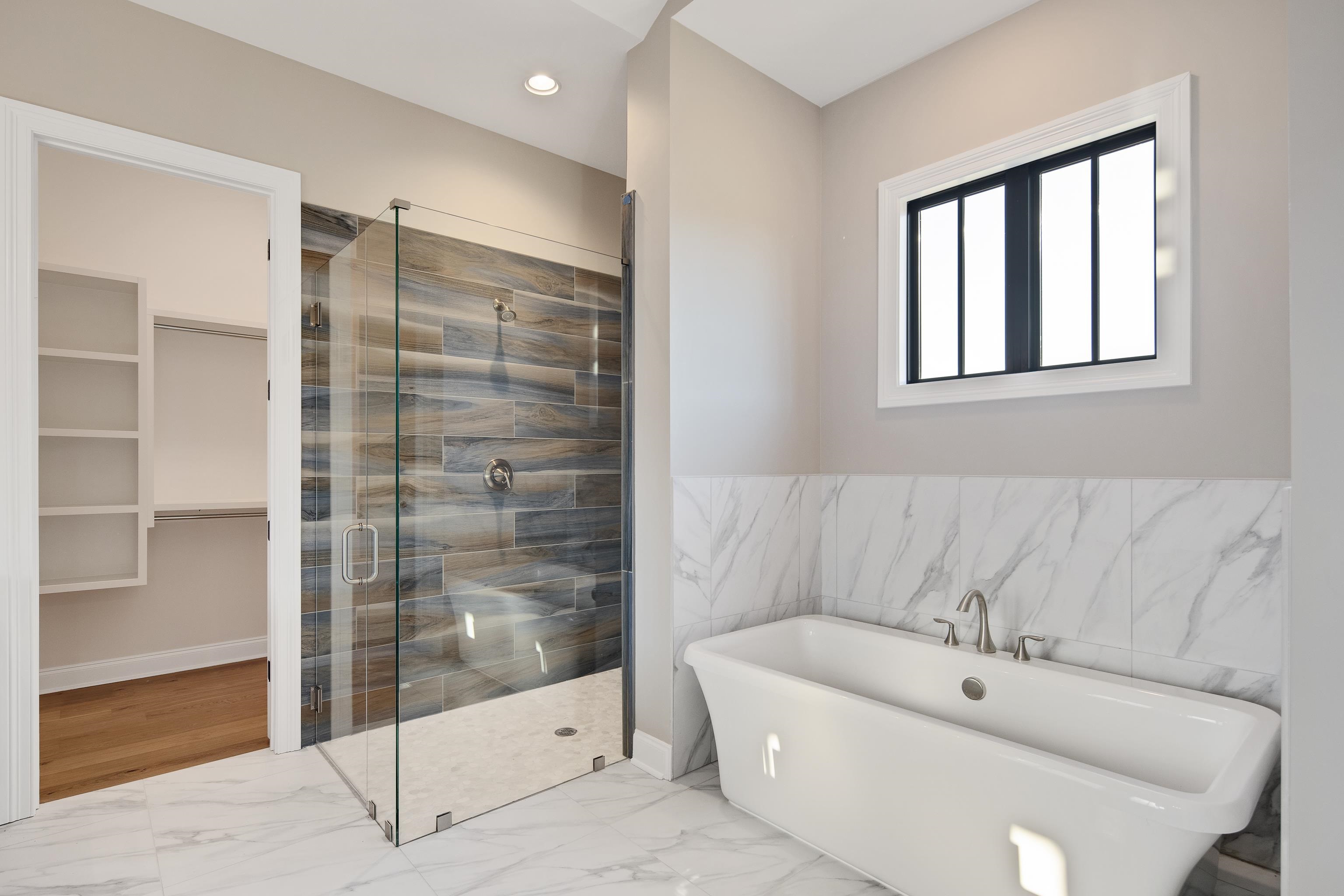 300 Mary Taylor Way Piperton, TN 38017 - Photo 23 of 36 a bathroom with a bathtub and a shower