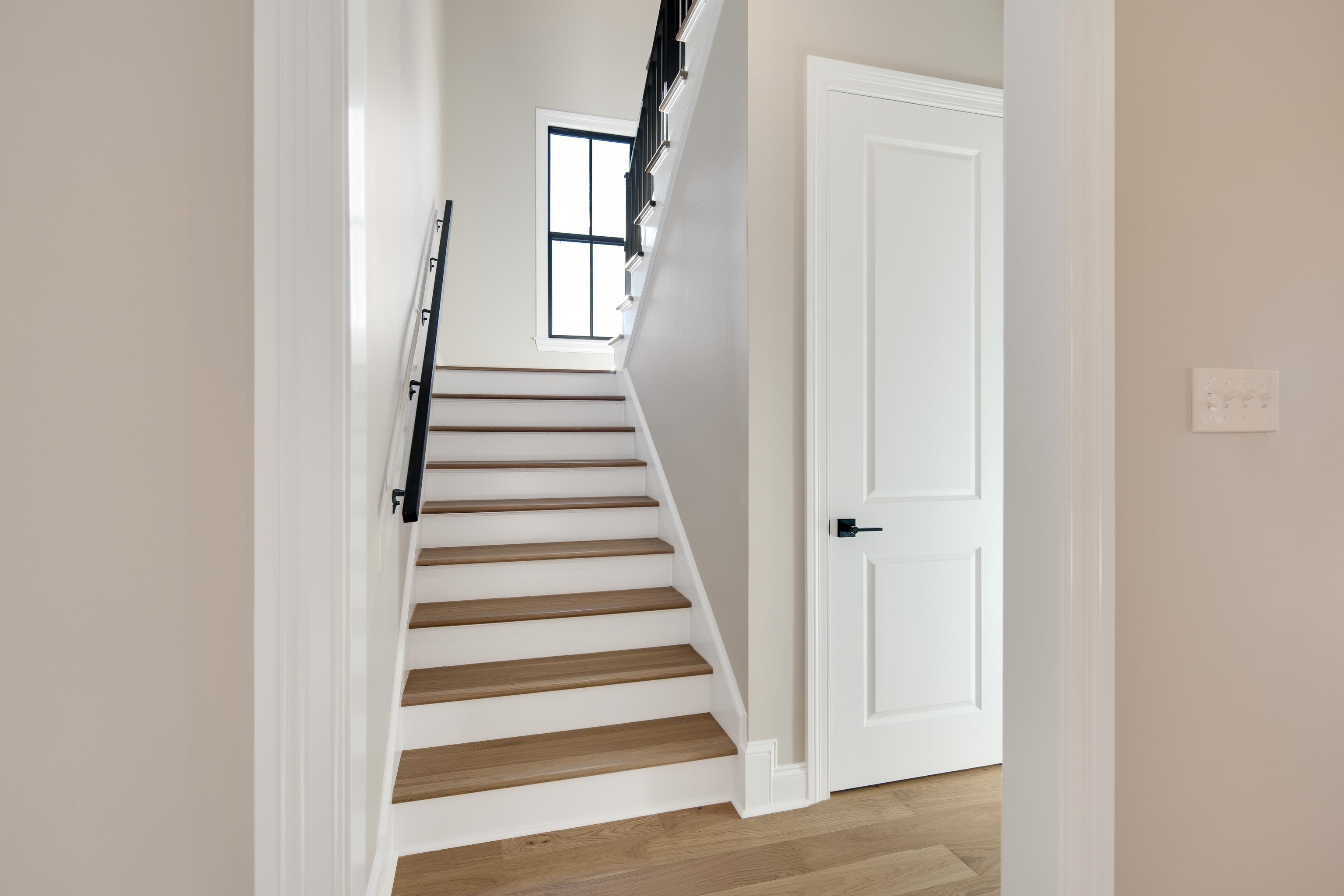 300 Mary Taylor Way Piperton, TN 38017 - Photo 27 of 36 a view of a hallway with wooden floor and windows