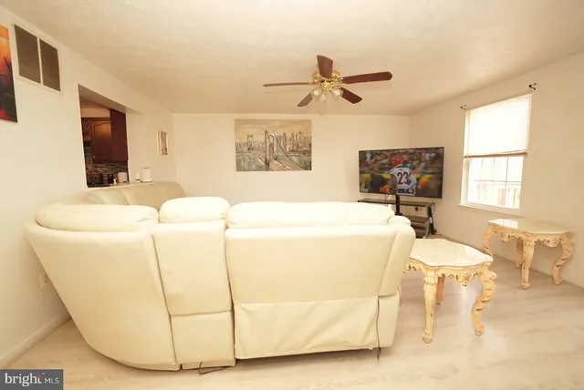 a living room with a couch and a flat screen tv