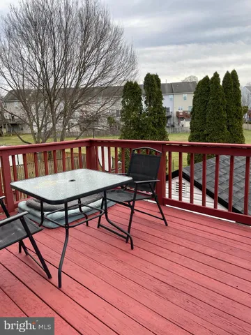 a view of a chairs on wooden deck