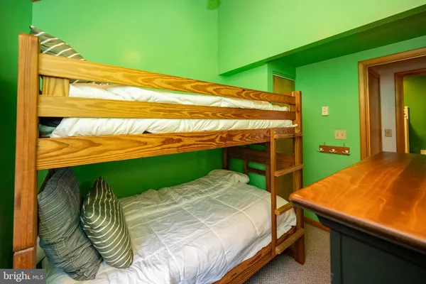 a bed sitting in a bedroom next to a yard