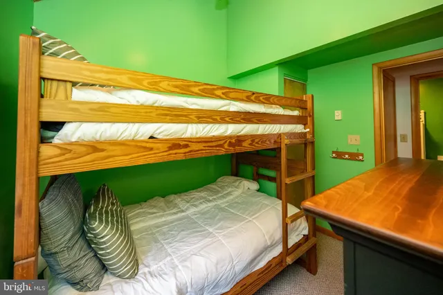 a bed sitting in a bedroom next to a yard