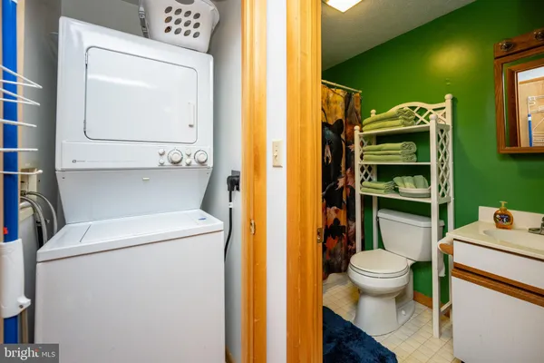 a bathroom with a toilet and a sink