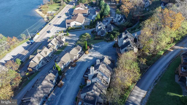 an aerial view of a house with a yard and outdoor seating