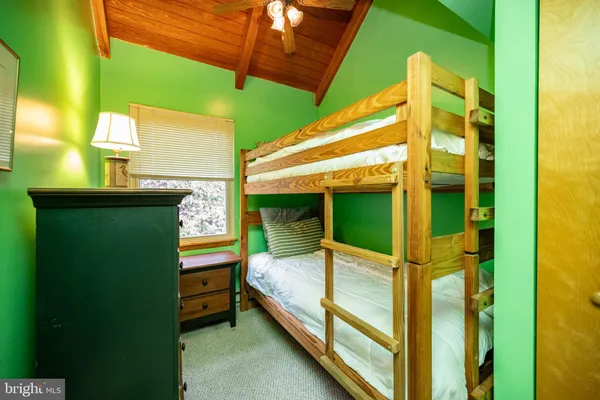 a bedroom with a bed and a table