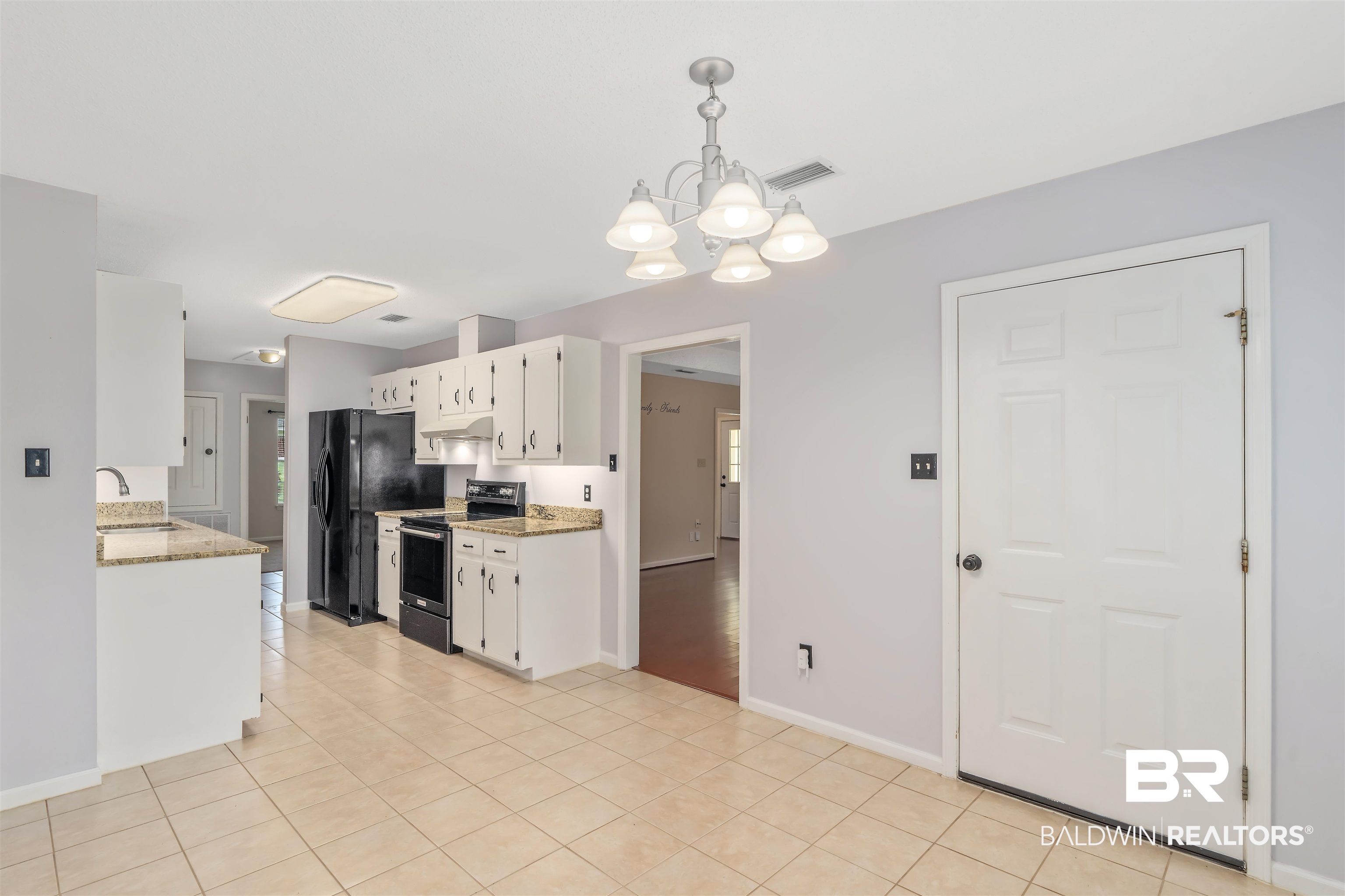 25779 Austin Road Daphne, AL 36526 - Photo 28 of 30 Kitchen featuring stainless steel electric range, black refrigerator with ice dispenser, a chandelier, white cabinetry, and a sink
