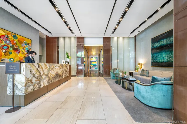 a lobby with furniture and window