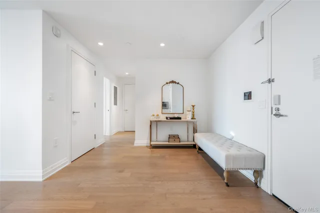 a living room with a bed furniture and a window