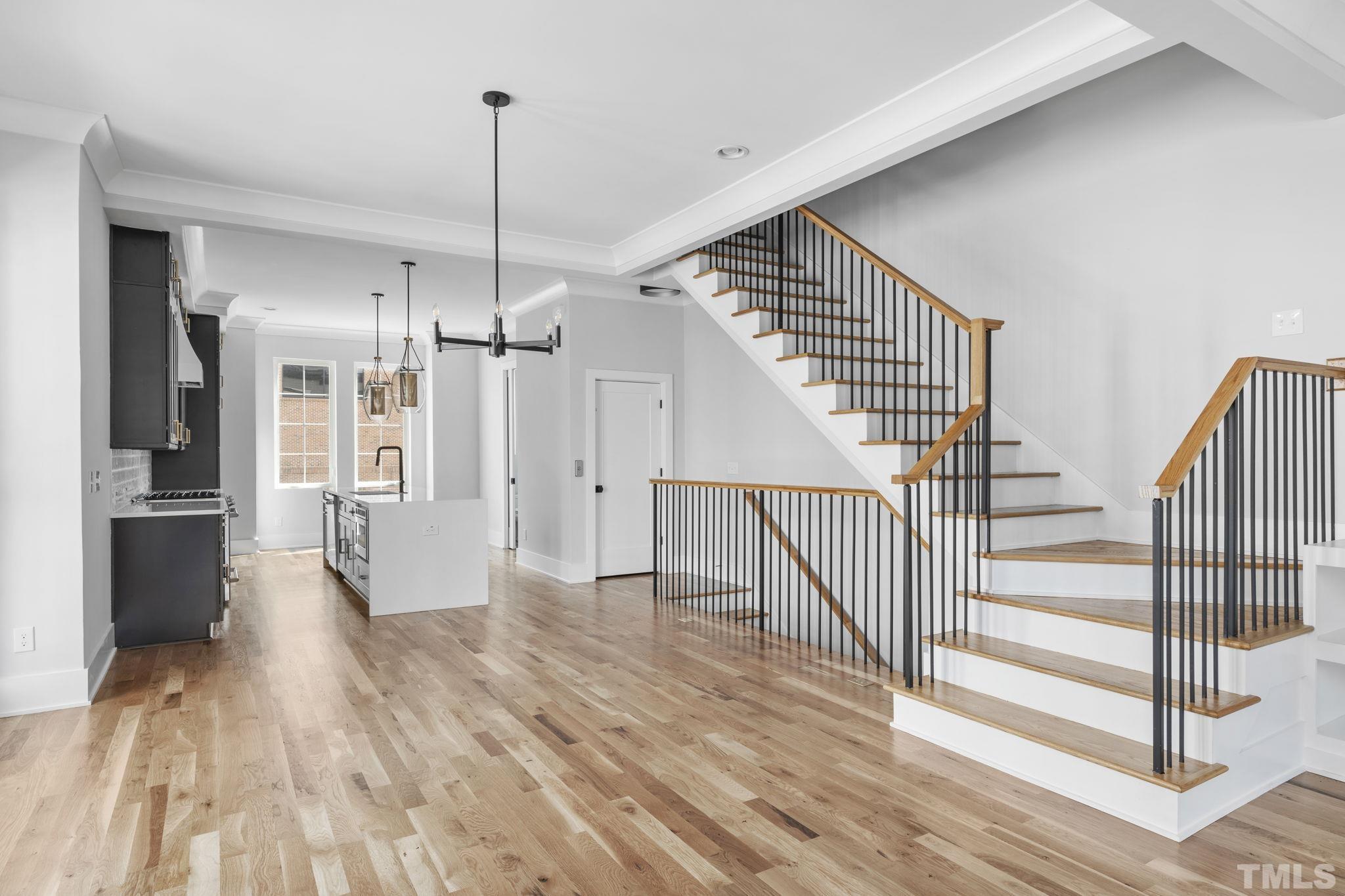 407 West Lenoir Street Raleigh, NC 27601 - Photo 12 of 42 a view of a hallway view with wooden floor and staircase