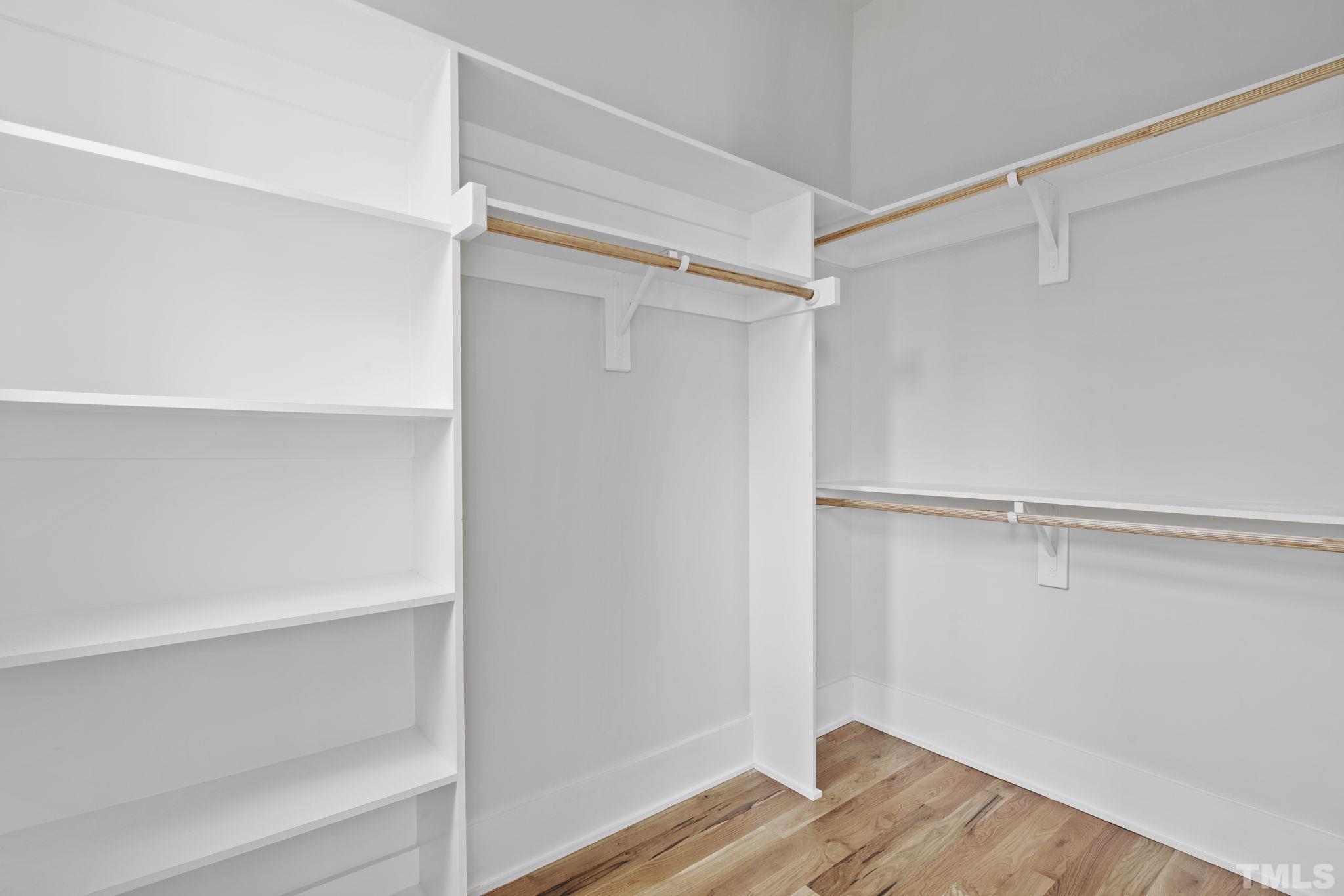 407 West Lenoir Street Raleigh, NC 27601 - Photo 16 of 42 a view of walk in closet with empty racks