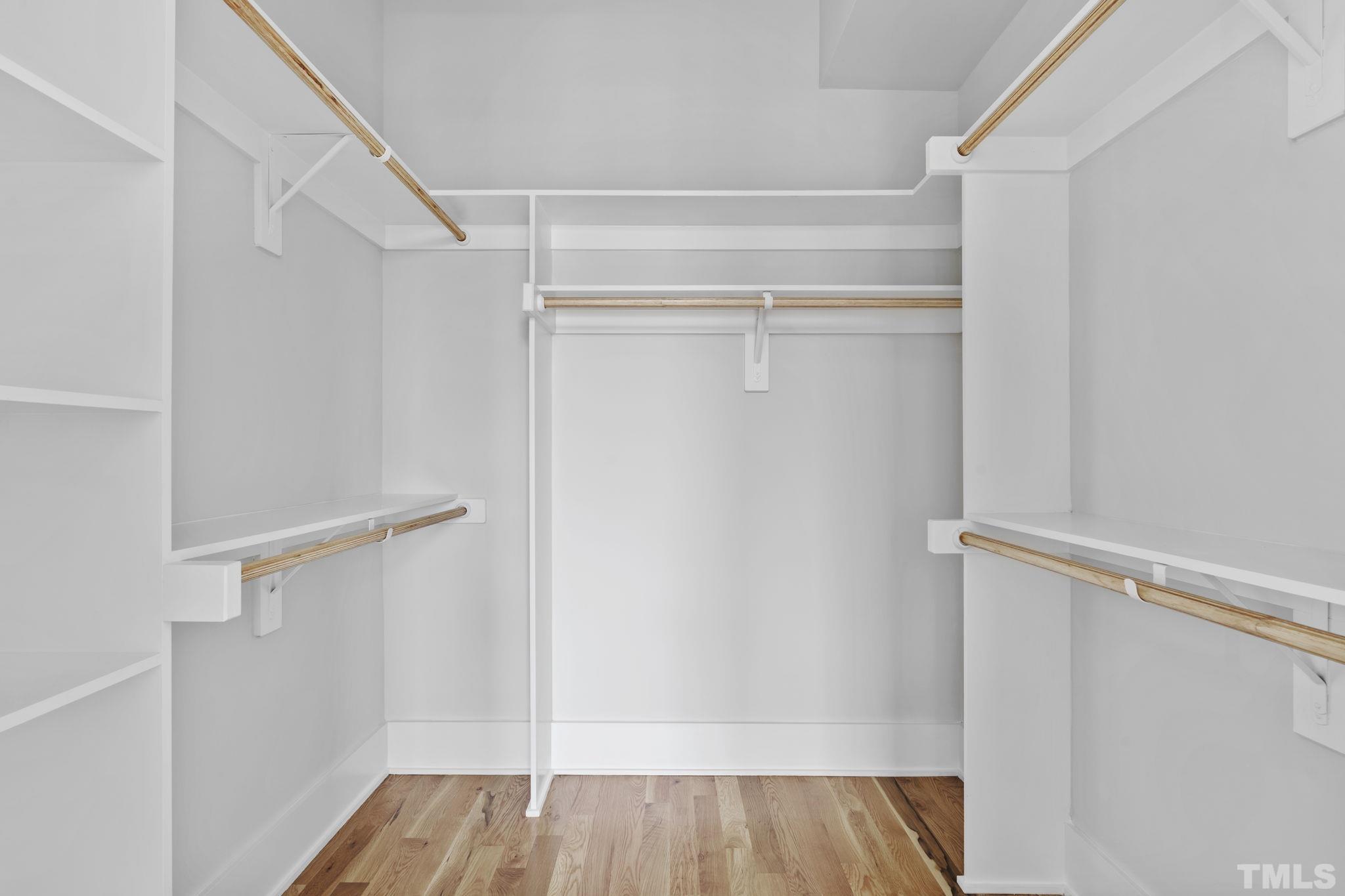 407 West Lenoir Street Raleigh, NC 27601 - Photo 21 of 42 a view of walk in closet with empty racks