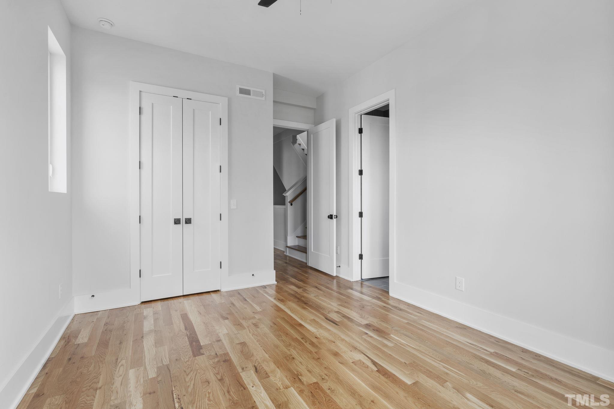 407 West Lenoir Street Raleigh, NC 27601 - Photo 23 of 42 a view of an empty room with wooden floor