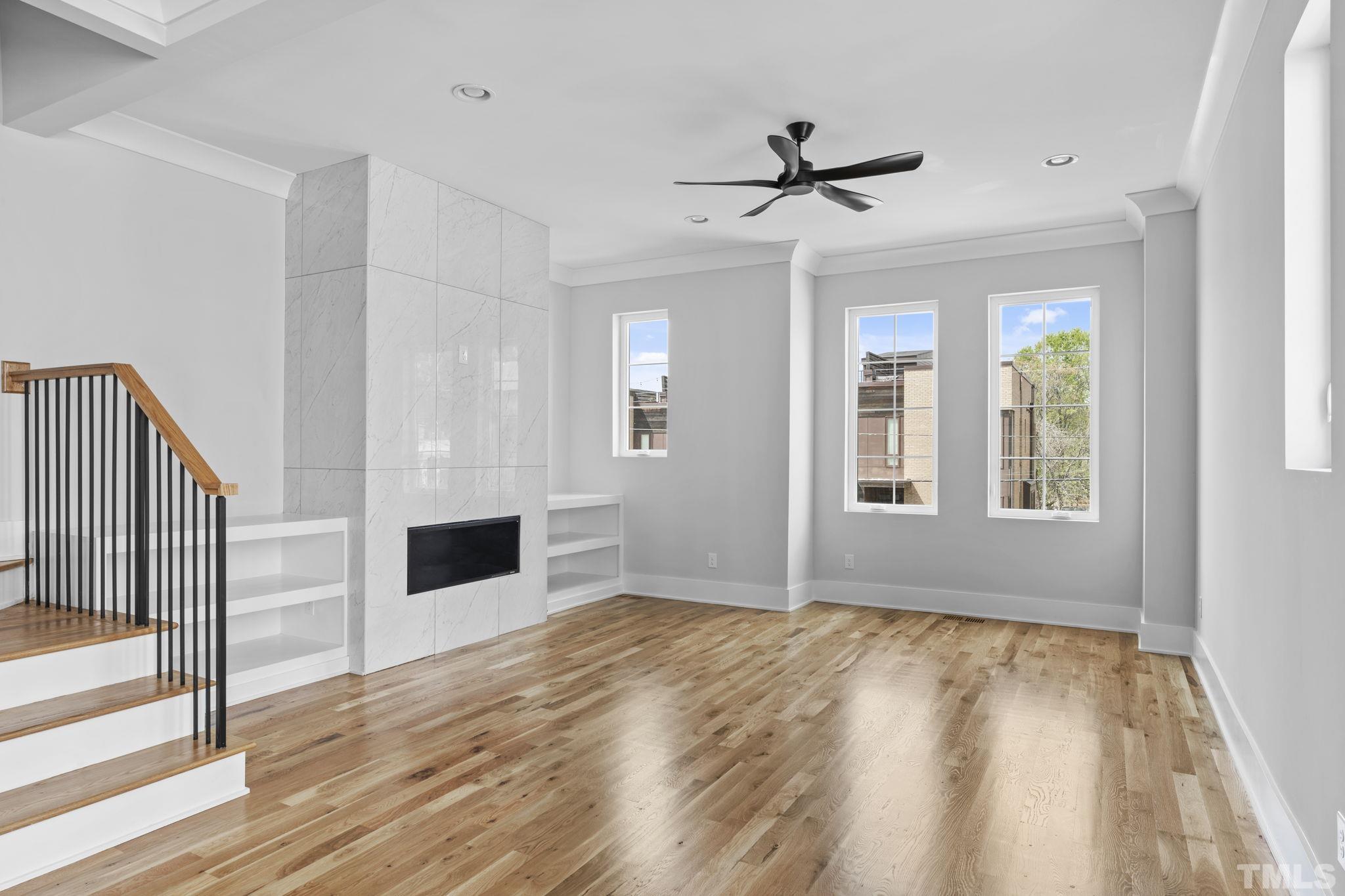 407 West Lenoir Street Raleigh, NC 27601 - Photo 25 of 42 a view of empty room with wooden floor and fan