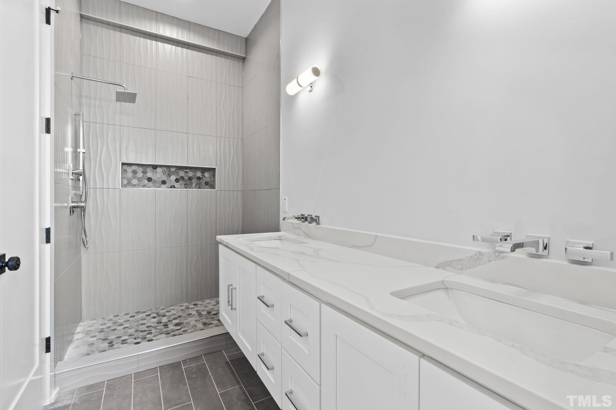 407 West Lenoir Street Raleigh, NC 27601 - Photo 28 of 42 a bathroom with a sink and a mirror